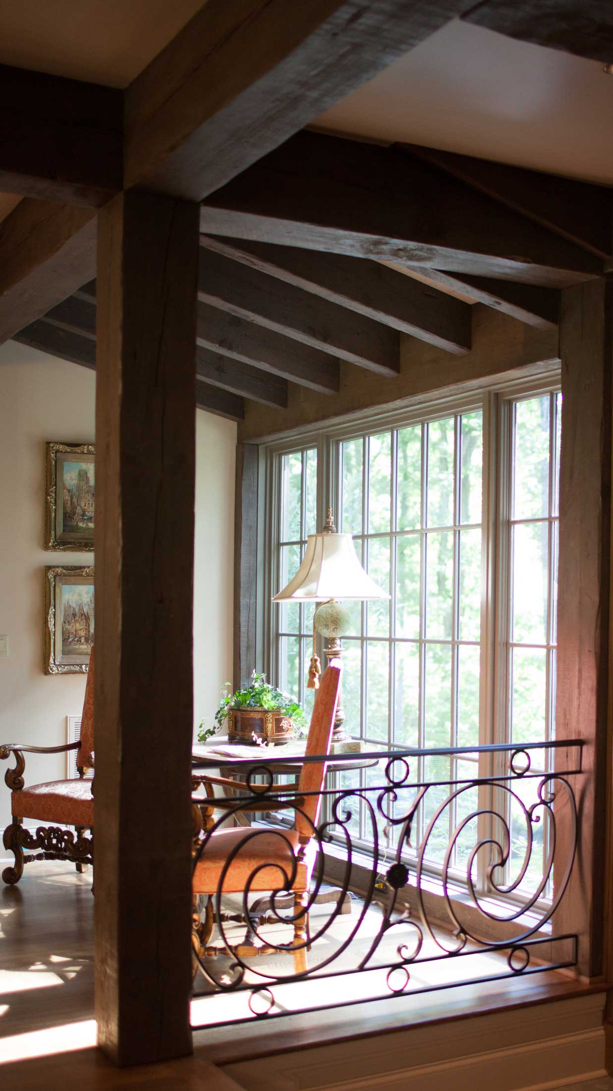 railing accent in wrought iron-dining room seating with view